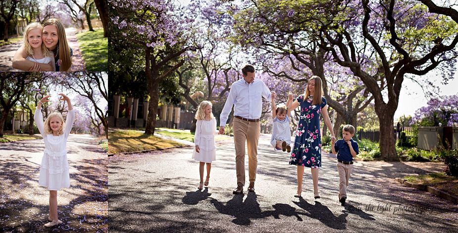 jacaranda lined street with a family