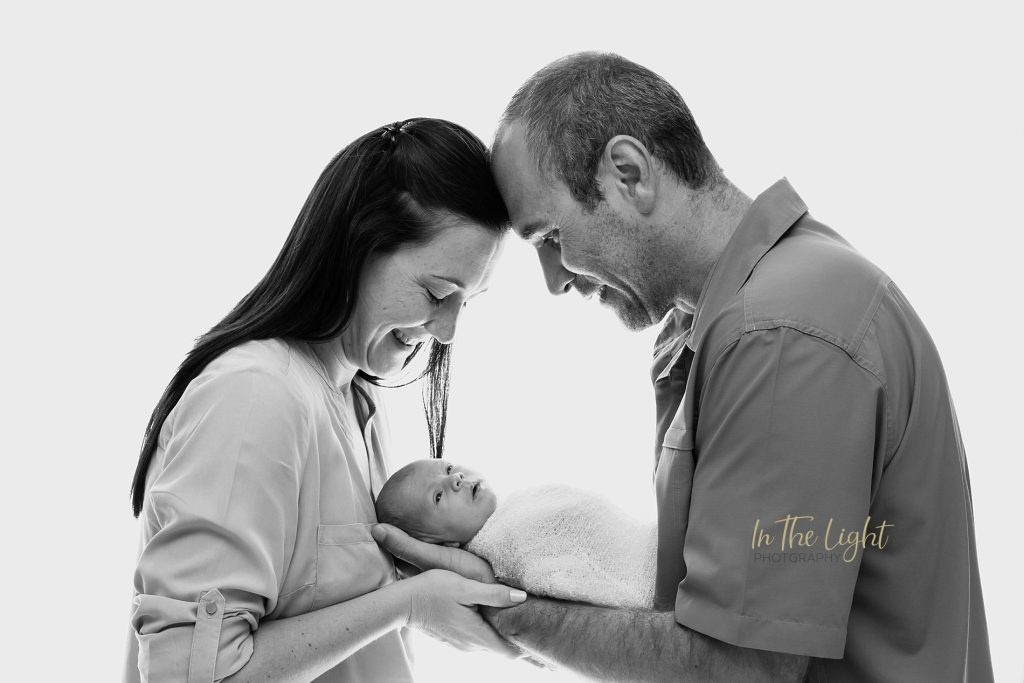 Newborn baby and her parents during an at home photo session in Centurion.