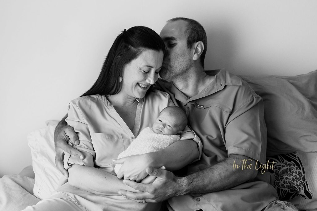 Newborn baby and her parents during an at home photo session in Centurion.
