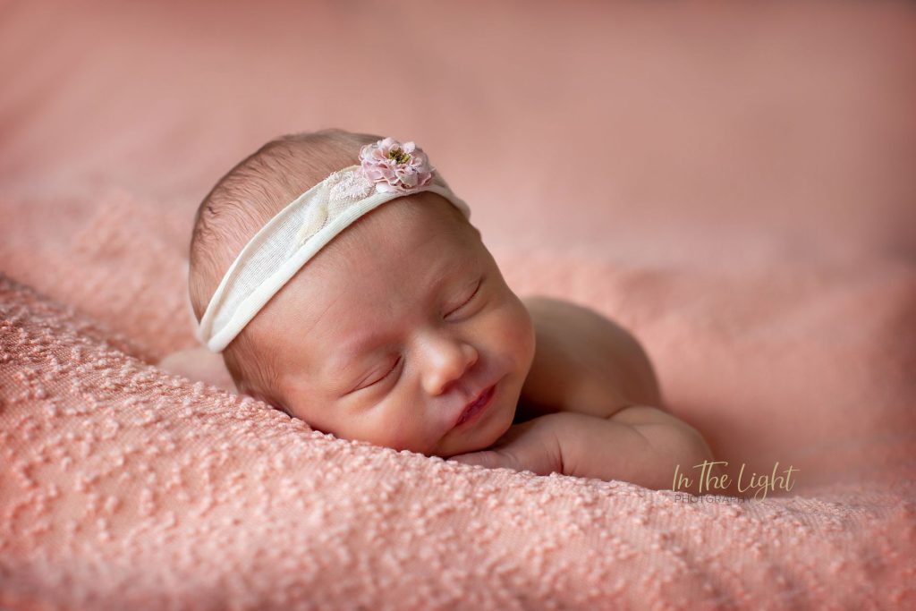 Newborn baby girl lying on a blanket in  during her photo session in Centurion.