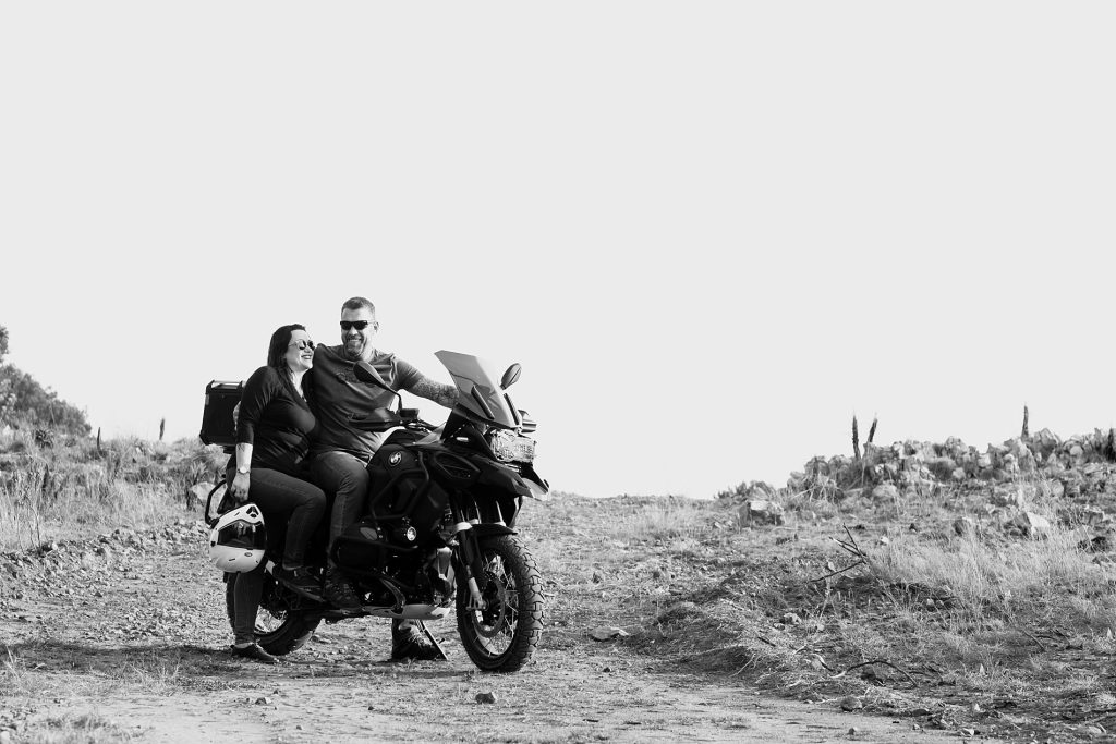 Black and white photo of a couple on their motorbike during their family photo session in Pretoria.