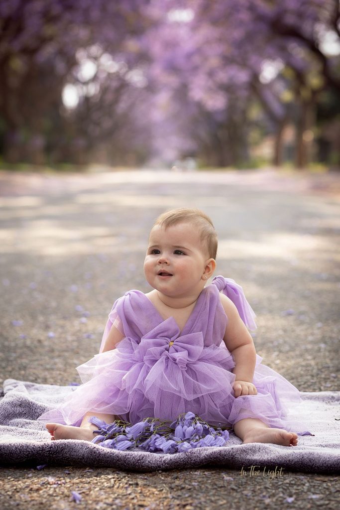 A sweet baby girl during her families Jacaranda photo session in Pretoria.