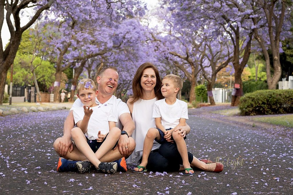 Magical Jacarandas as background for this family's photo.