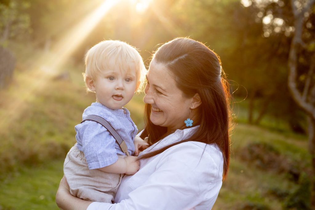 A mom and son enjoying late afternoon sun during a family photo session at Struben Dam, Pretoria